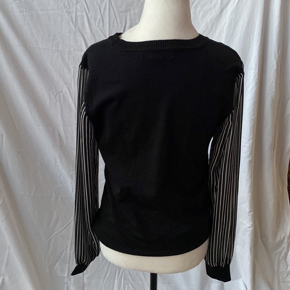 Black sweater with black and white striped sleeves. Great condition. - Picture 3 of 7